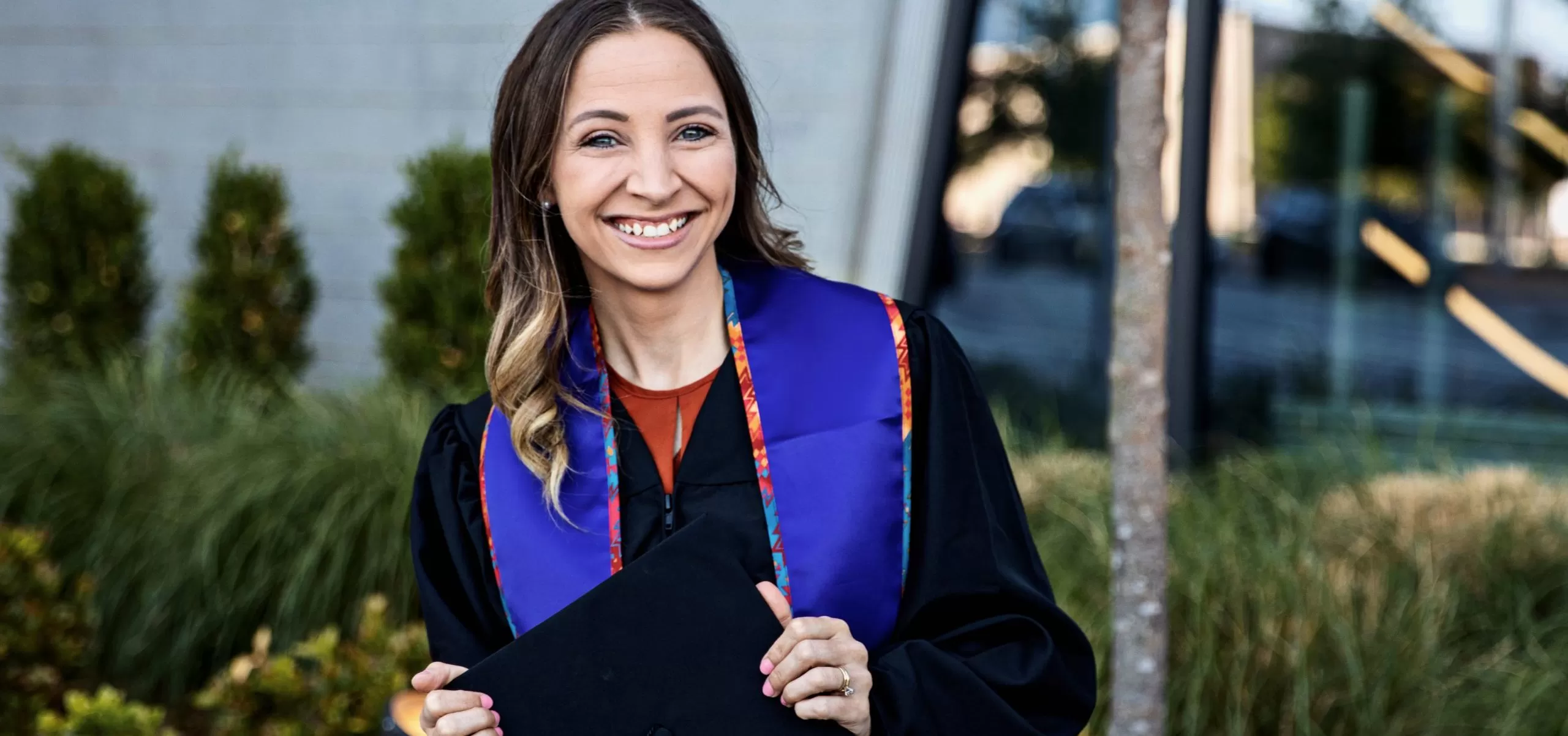 Girl holding graduation cap