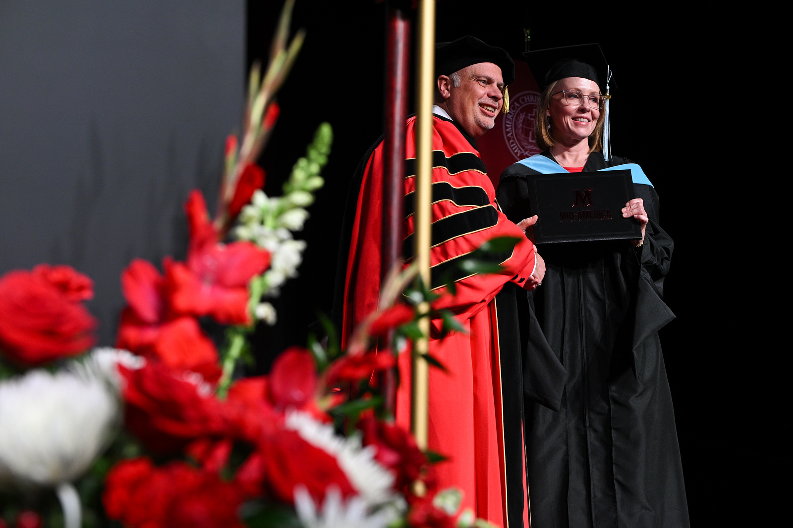 President Greenwald with a graduating student at the Oklahoma City Convention Center.