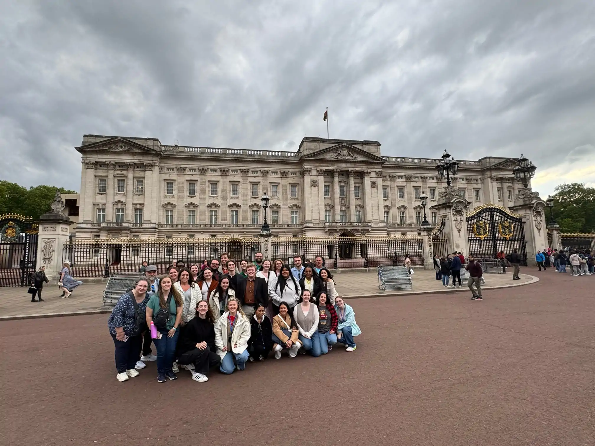 A group of MACU students and staff in front of Buckingham Palace in London, England.